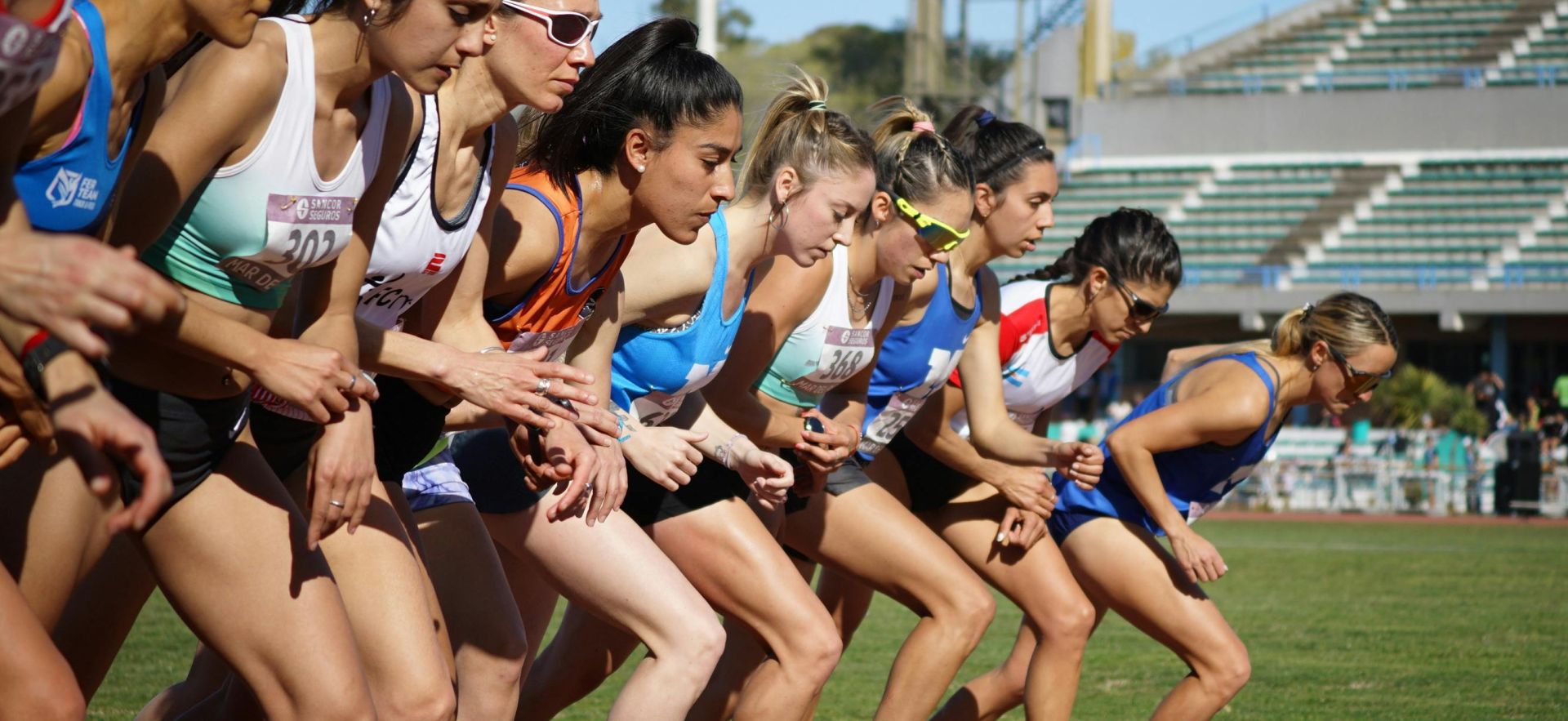 Female athletes at the starting line of a track event in Mar del Plata, Argentina.